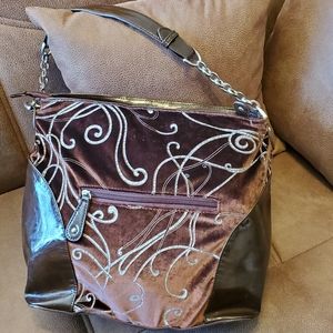 Brown velvet and patent handbag with lamb logo